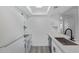 Well-lit kitchen featuring white cabinets and appliances, with modern countertops and a stainless steel sink at 616 S Hardy Dr # 220, Tempe, AZ 85281