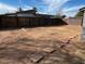 View of the backyard with wood fence and shed at 619 W Cocopah St, Phoenix, AZ 85003