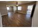 Spacious living room with wood-look floors, great natural light, and neutral paint at 619 W Cocopah St, Phoenix, AZ 85003