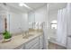 Cozy bathroom featuring a white vanity, tub/shower combo, and a large mirror at 6315 E Kelton Ln, Scottsdale, AZ 85254