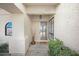 Inviting entryway with textured walls and a decorative front door at 6315 E Kelton Ln, Scottsdale, AZ 85254