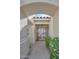 Inviting entryway with textured walls leads to an interior view with hardwood floors at 6315 E Kelton Ln, Scottsdale, AZ 85254