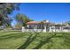 Beautiful home featuring desert landscaping and a tile roof with a wrought iron fence at 6315 E Kelton Ln, Scottsdale, AZ 85254