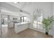 Modern kitchen featuring white cabinets, countertops, and hardwood floors at 6315 E Kelton Ln, Scottsdale, AZ 85254