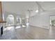 Bright living room with hardwood floors, fireplace, vaulted ceilings, and expansive windows at 6315 E Kelton Ln, Scottsdale, AZ 85254