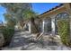 Relaxing outdoor patio area featuring decorative plants, lounge chair, and ample windows at 6315 E Kelton Ln, Scottsdale, AZ 85254