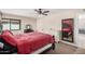 A charming bedroom features a large bed, dresser, and full-length mirror at 6405 W Saguaro Dr, Glendale, AZ 85304