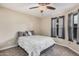 Neutral bedroom features updated ceiling fan, natural light and carpet at 6405 W Saguaro Dr, Glendale, AZ 85304