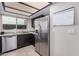 Kitchen featuring stainless steel appliances, granite countertops, and dark cabinetry at 6405 W Saguaro Dr, Glendale, AZ 85304