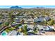 An aerial view highlights a neighborhood's homes, showcasing various yards, pools, and lush desert landscaping at 6420 N 85Th Pl, Scottsdale, AZ 85250