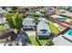 Aerial view of a home featuring manicured front yard, a backyard putting green, pool, and stylish outdoor space at 6420 N 85Th Pl, Scottsdale, AZ 85250