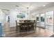 Elegant dining room with ample seating and stylish decor next to sliding glass doors at 6420 N 85Th Pl, Scottsdale, AZ 85250