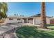 Charming single-story home showcasing manicured lawn and a welcoming front entrance with ample parking at 6420 N 85Th Pl, Scottsdale, AZ 85250