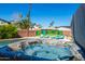 A luxurious hot tub with a view of a colorful Scottsdale mural and lounge chairs, perfect for relaxation at 6420 N 85Th Pl, Scottsdale, AZ 85250