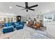 Bright and spacious living room with modern furnishings flowing into open kitchen area at 6420 N 85Th Pl, Scottsdale, AZ 85250