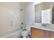 Bathroom with white tub, toilet and sink at 6557 W Puget Ave, Glendale, AZ 85302