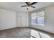 Bedroom with closet and ceiling fan at 6557 W Puget Ave, Glendale, AZ 85302