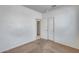 Bedroom featuring neutral walls, carpet, closet, and window, offering a cozy space at 6557 W Puget Ave, Glendale, AZ 85302