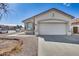 Charming single-story home with a two car garage and desert landscaping at 6557 W Puget Ave, Glendale, AZ 85302