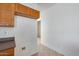 Neutral hallway with tile flooring and easy access to utilities at 6557 W Puget Ave, Glendale, AZ 85302