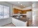 Bright kitchen featuring oak cabinets and a functional layout with tile floors at 6557 W Puget Ave, Glendale, AZ 85302