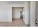 Bright living room showcasing neutral walls and tiled floors, creating a fresh and open space at 6557 W Puget Ave, Glendale, AZ 85302