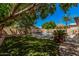Spacious backyard featuring a swimming pool and lush green lawn, perfect for outdoor living at 6640 W Honeysuckle Dr, Phoenix, AZ 85083
