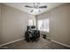 Bedroom featuring neutral walls, carpet flooring, and large windows at 6640 W Honeysuckle Dr, Phoenix, AZ 85083