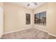 A bedroom with neutral walls, neutral carpet, and natural light at 6640 W Honeysuckle Dr, Phoenix, AZ 85083