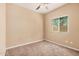 This bedroom has neutral walls, brown carpet and a window that provides natural light at 6640 W Honeysuckle Dr, Phoenix, AZ 85083