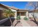 Close up on front entrance featuring well maintained desert landscaping and a concrete pathway leading to the front door at 6640 W Honeysuckle Dr, Phoenix, AZ 85083