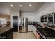 Modern kitchen featuring stainless steel appliances, granite countertops, and white cabinetry at 6640 W Honeysuckle Dr, Phoenix, AZ 85083