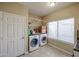 Well lit laundry room featuring newer model washer and dryer units at 6640 W Honeysuckle Dr, Phoenix, AZ 85083