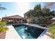 Sparkling pool with lush landscaping, ideal for summer relaxation at 6640 W Honeysuckle Dr, Phoenix, AZ 85083