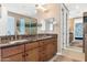 Modern bathroom features granite counters, modern fixtures, and a huge mirrored wall at 7295 N Scottsdale Rd # 1004, Paradise Valley, AZ 85253