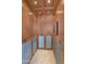 An elevator featuring wooden walls, stainless steel accents, and soft lighting at 7295 N Scottsdale Rd # 1004, Paradise Valley, AZ 85253