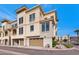 Exterior view of townhomes showcases the architectural design and attached garages at 7295 N Scottsdale Rd # 1004, Paradise Valley, AZ 85253