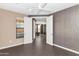 Inviting space with neutral walls and a ceiling fan, connected to another room through double doors at 7295 N Scottsdale Rd # 1004, Paradise Valley, AZ 85253