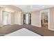 Spacious main bedroom featuring a carpet, door to balcony, and ensuite bath at 7295 N Scottsdale Rd # 1004, Paradise Valley, AZ 85253