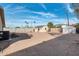 A spacious backyard provides a detached storage shed and is surrounded by block fencing at 744 E Meadow Ln, Phoenix, AZ 85022