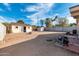 A large backyard features a detached shed with a double door and plenty of room to enjoy at 744 E Meadow Ln, Phoenix, AZ 85022