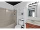 Bathroom featuring a shower-tub combination, white fixtures and a single sink vanity at 744 E Meadow Ln, Phoenix, AZ 85022