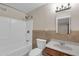 Neutral bathroom featuring a shower-tub combination with decorative tiling and a single sink vanity at 744 E Meadow Ln, Phoenix, AZ 85022