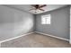 Bedroom featuring carpet flooring, a modern ceiling fan, and a window offering natural light at 744 E Meadow Ln, Phoenix, AZ 85022