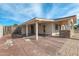 This house features a large covered patio, a mix of brick, and painted concrete at 744 E Meadow Ln, Phoenix, AZ 85022