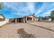 Inviting single-story home featuring a brick driveway and covered carport at 744 E Meadow Ln, Phoenix, AZ 85022