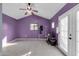 Living Room featuring tile flooring, purple walls and a ceiling fan at 744 E Meadow Ln, Phoenix, AZ 85022