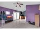 Living Room featuring purple walls, tile flooring and a ceiling fan at 744 E Meadow Ln, Phoenix, AZ 85022