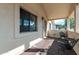 Relaxing covered porch area with neutral tones and space for seating at 744 E Meadow Ln, Phoenix, AZ 85022