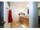 Bright bathroom with double vanity, granite countertops, and tile flooring at 7609 W Whitehorn Trl, Peoria, AZ 85383